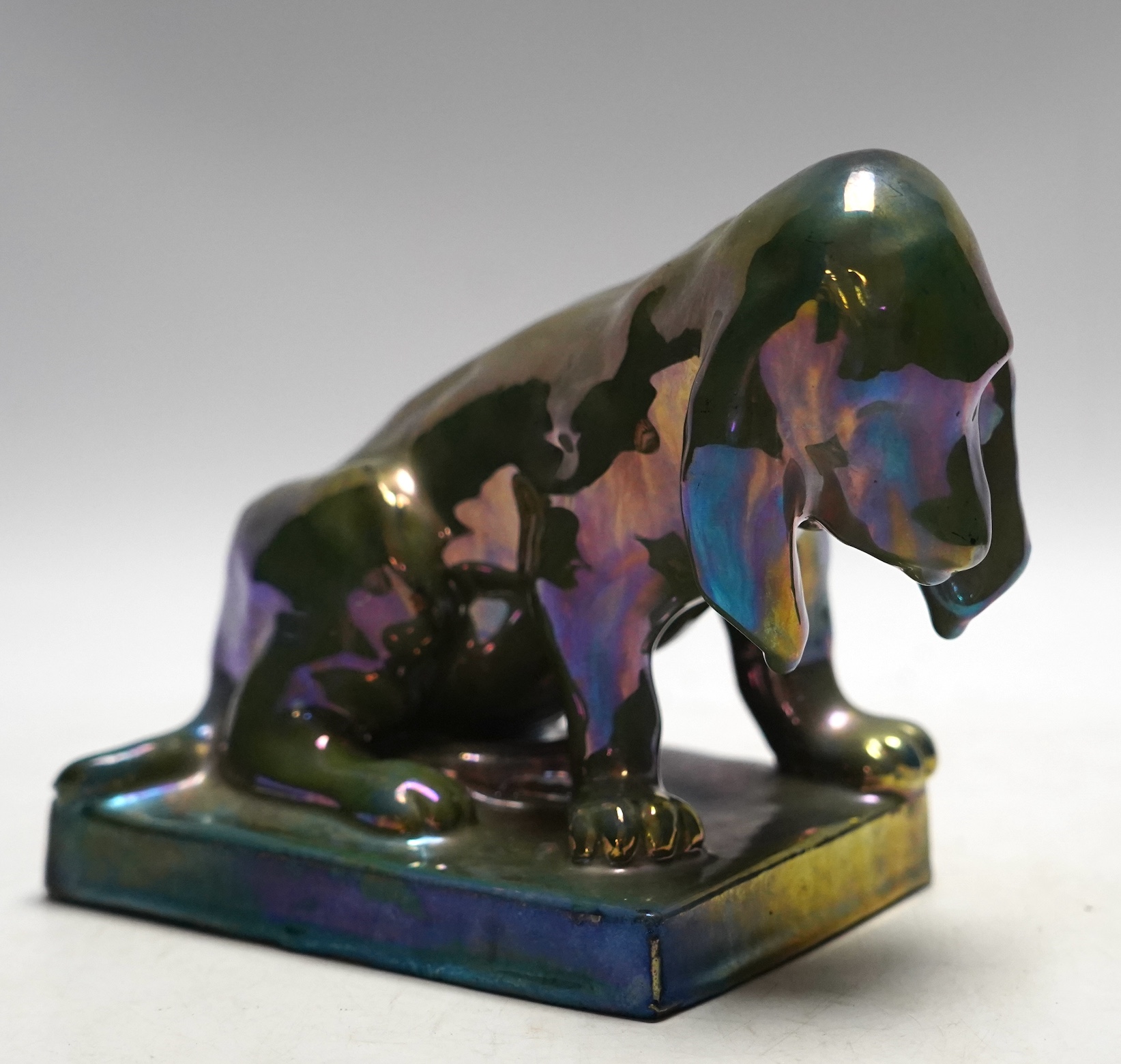 Alphonse Cytere, a French pottery lustre dog, stamped to the base, 18cm wide